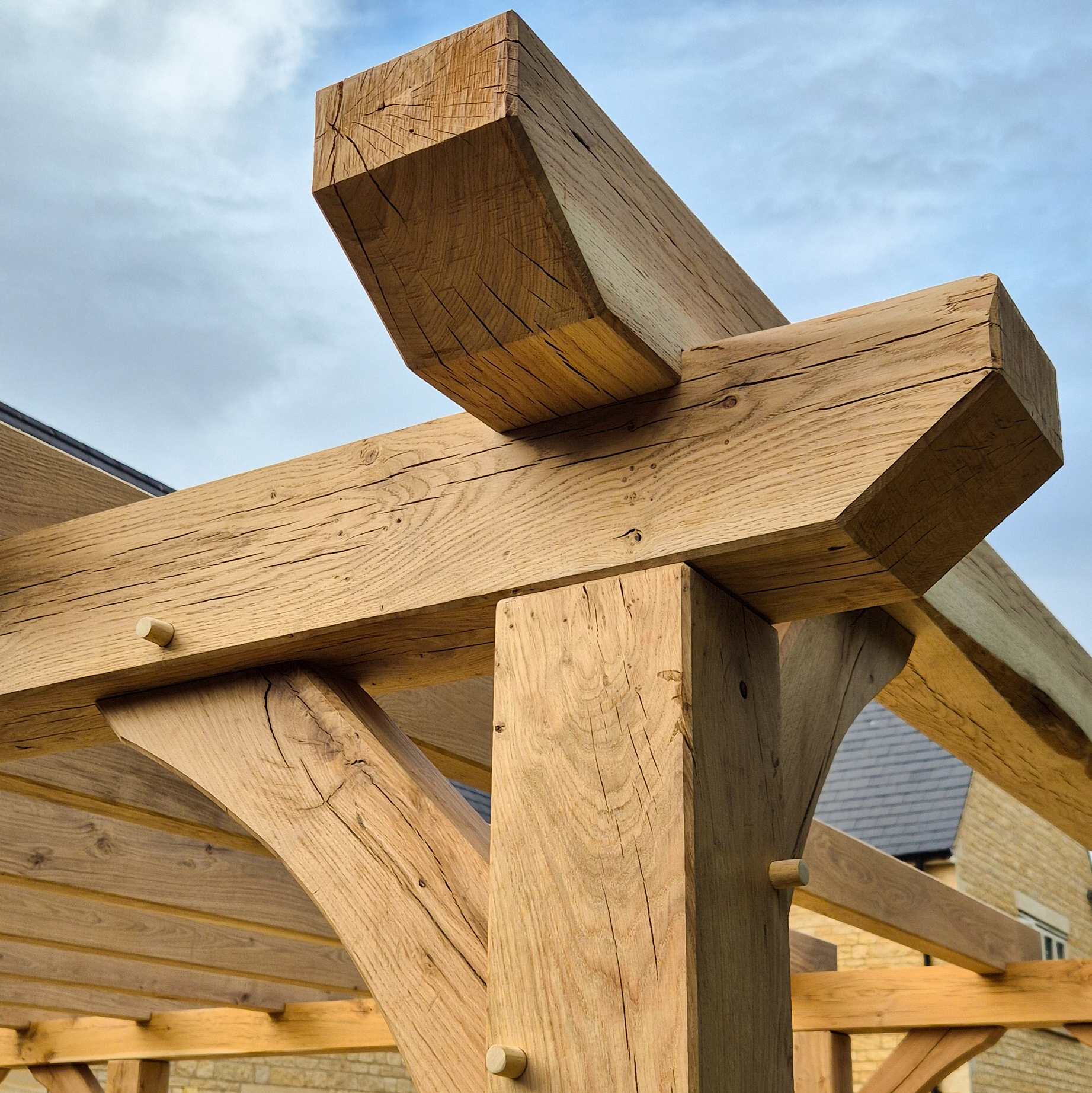 Oak pergola joinery detail showing clean timber connections.